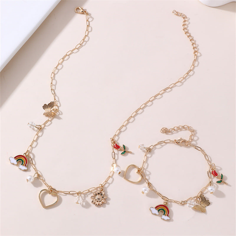 Collana con ciondolo a farfalla floreale e fiocco per bambine, lega di zinco, design a cuore, arcobaleno e rosa