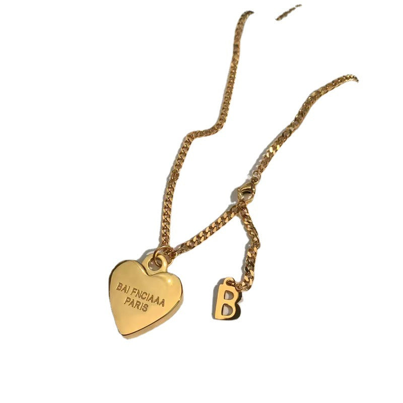 Minimalist Luxe Heart-Shaped Titanium Steel Necklace for Women with Gold Plating and Cross Chain Design