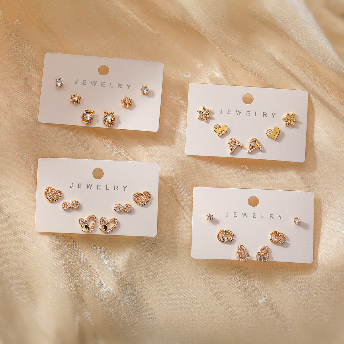 Orecchini da donna geometrici placcati oro 18 carati su base in rame con intarsio di zirconi