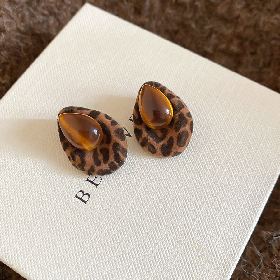 Pendientes de botón de acero chapado de estilo lujoso con perlas de imitación y detalles de ojo de tigre con diseño floral para mujer