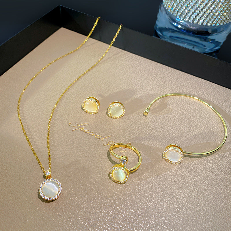 Minimalist Luxury Round Micro-Paved Cubic Zirconia Rotating Cat's Eye Moonstone Titanium Steel Necklace for Women