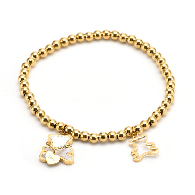 Bracciale Minimalista con Orsetto in Acciaio al Titanio, Perline, Intarsio in Madreperla e Placcatura in Oro per Donne