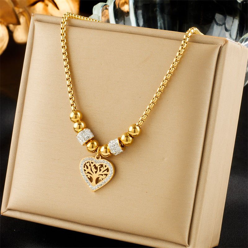 Elegante collar minimalista de acero de titanio con colgante en forma de corazón del Árbol de la Vida, chapado en oro y con cadena de cuentas para mujer