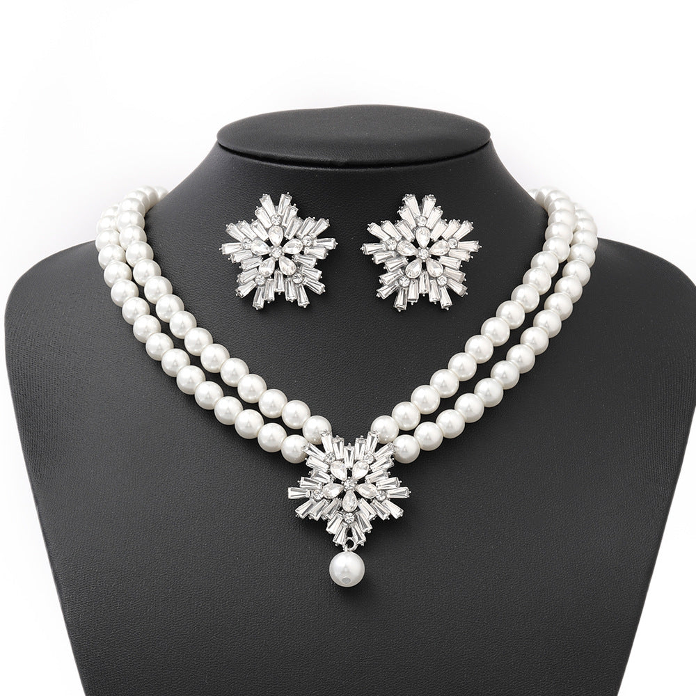 Original Design Snowflake Pendant Set with Imitation Pearl Necklace, Rhinestone Earrings, and Pearl Bracelet for Women